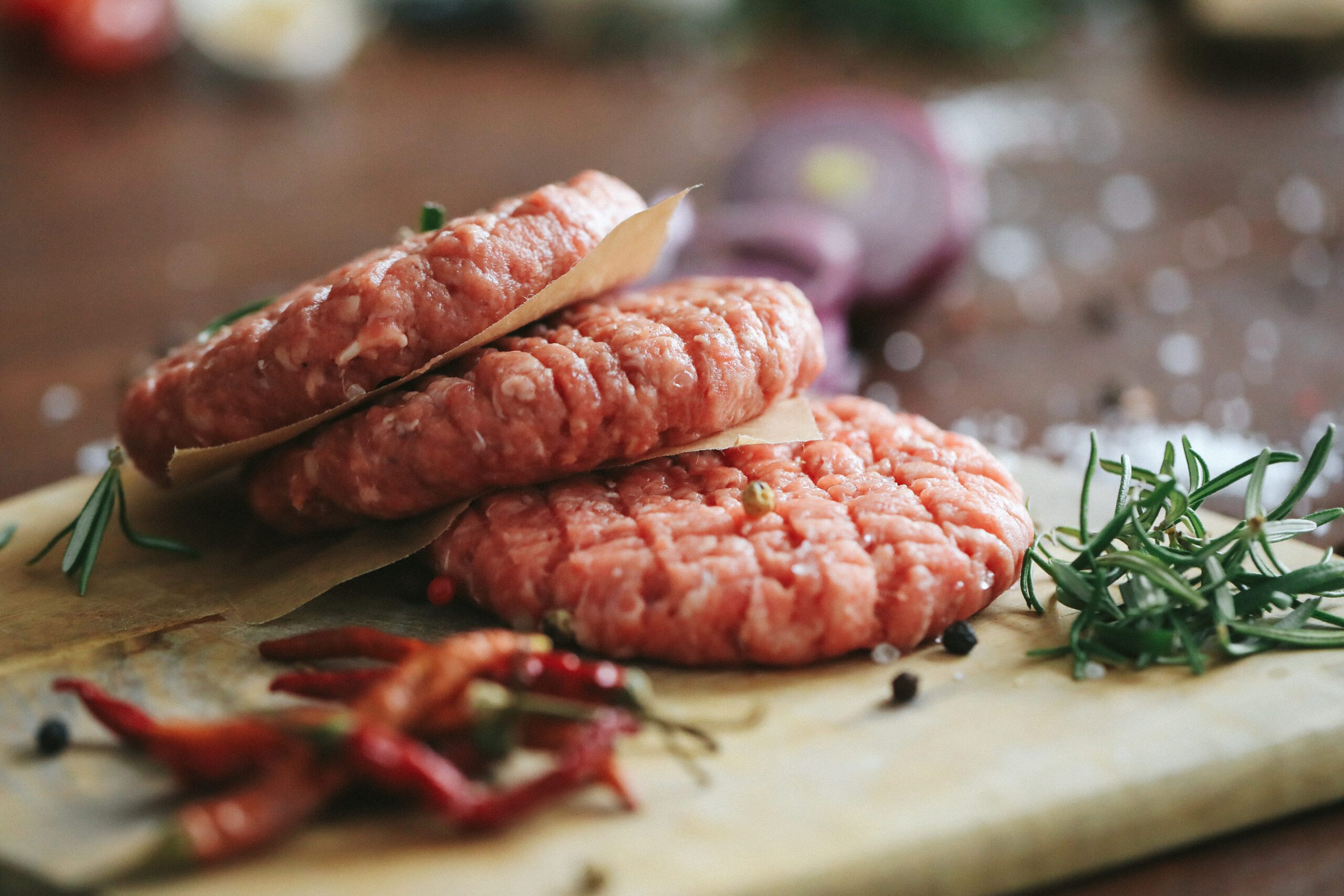 raw-beef-hamburger-patties-with-herbs-spices